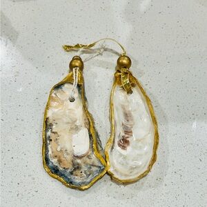 SOLD.  Gorgeous handcrafted ornaments. Oyster shells gilded & glossed. Set of 2.